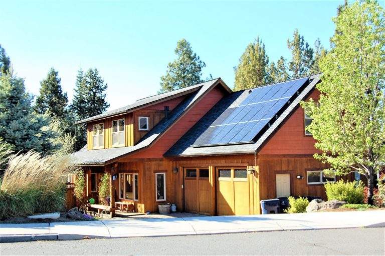 Southern Crossing Neighborhood Bend attractive modern home with natural siding and solar panels